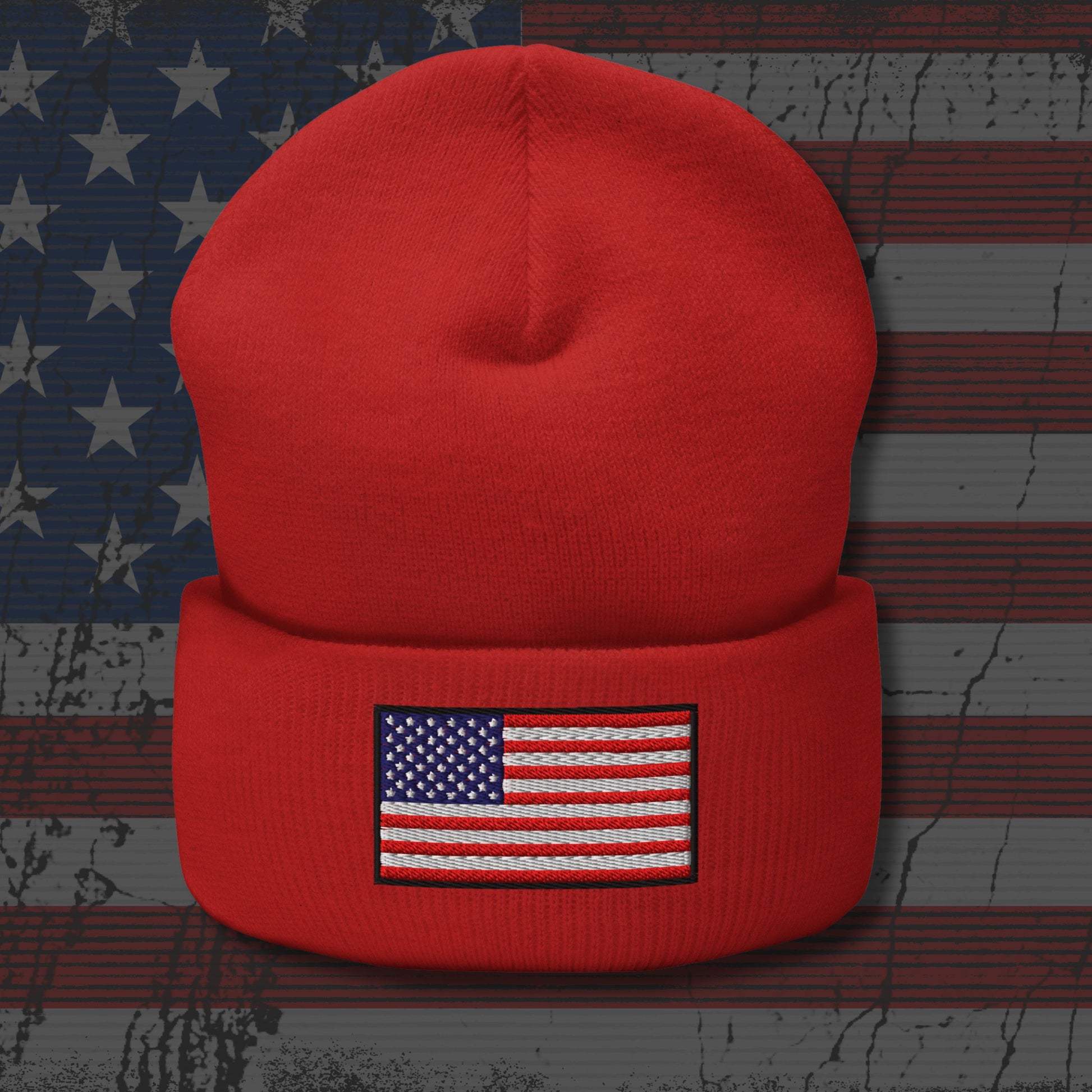 Red beanie with American flag patch on a distressed American flag background