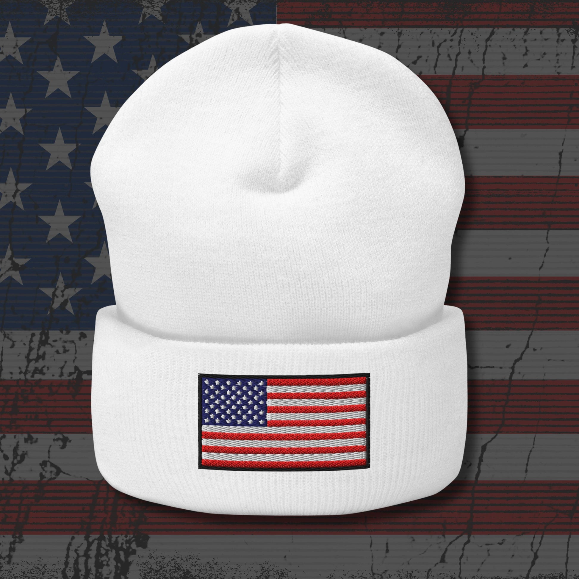 White beanie with American flag patch on a distressed American flag background