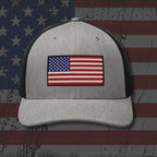 Gray cap with American flag patch on a distressed American flag background