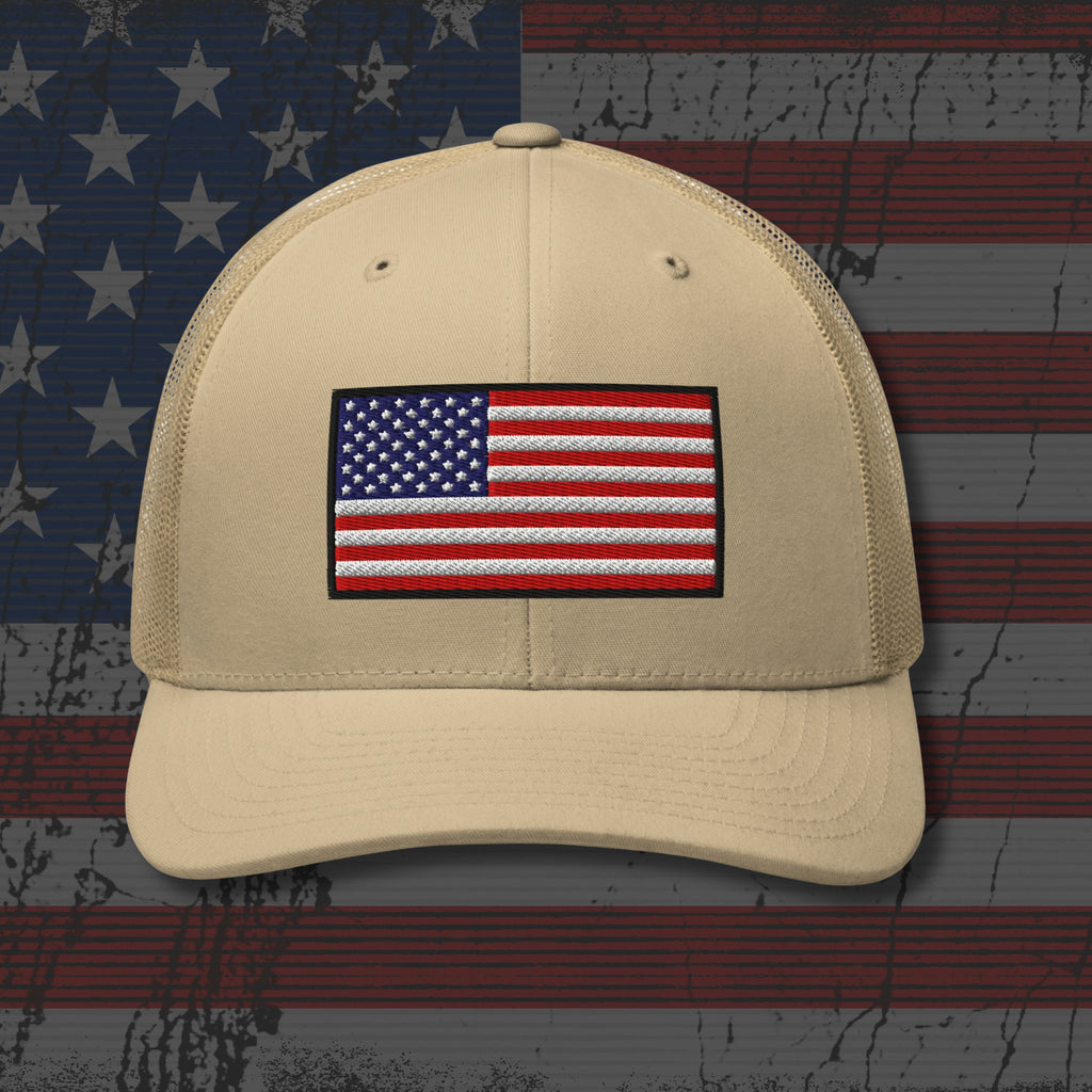 Beige cap with American flag patch on a distressed American flag background