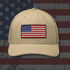 Beige cap with American flag patch on a distressed American flag background