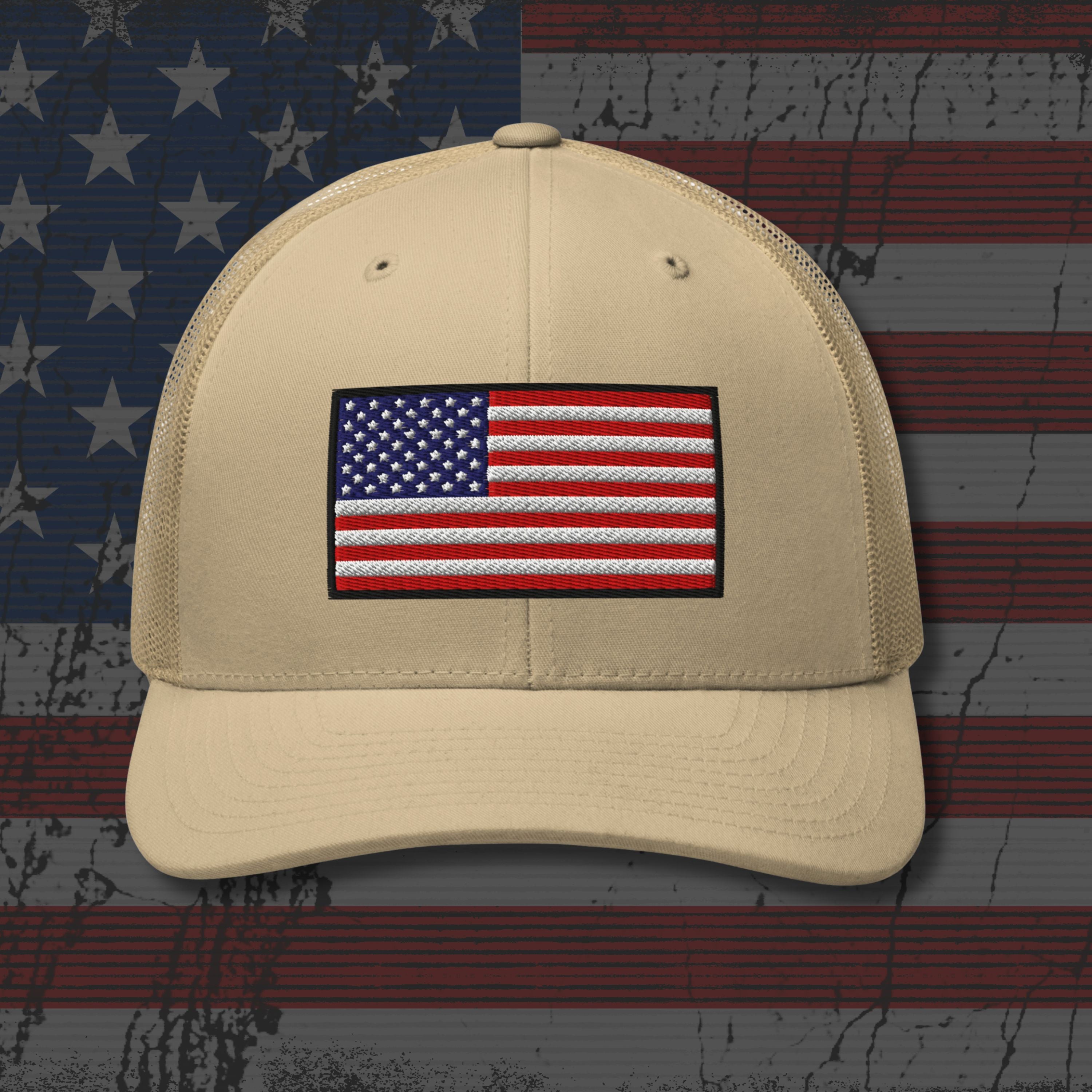 Beige cap with American flag patch on a distressed American flag background