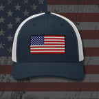 Navy and white cap with American flag patch on a distressed American flag background