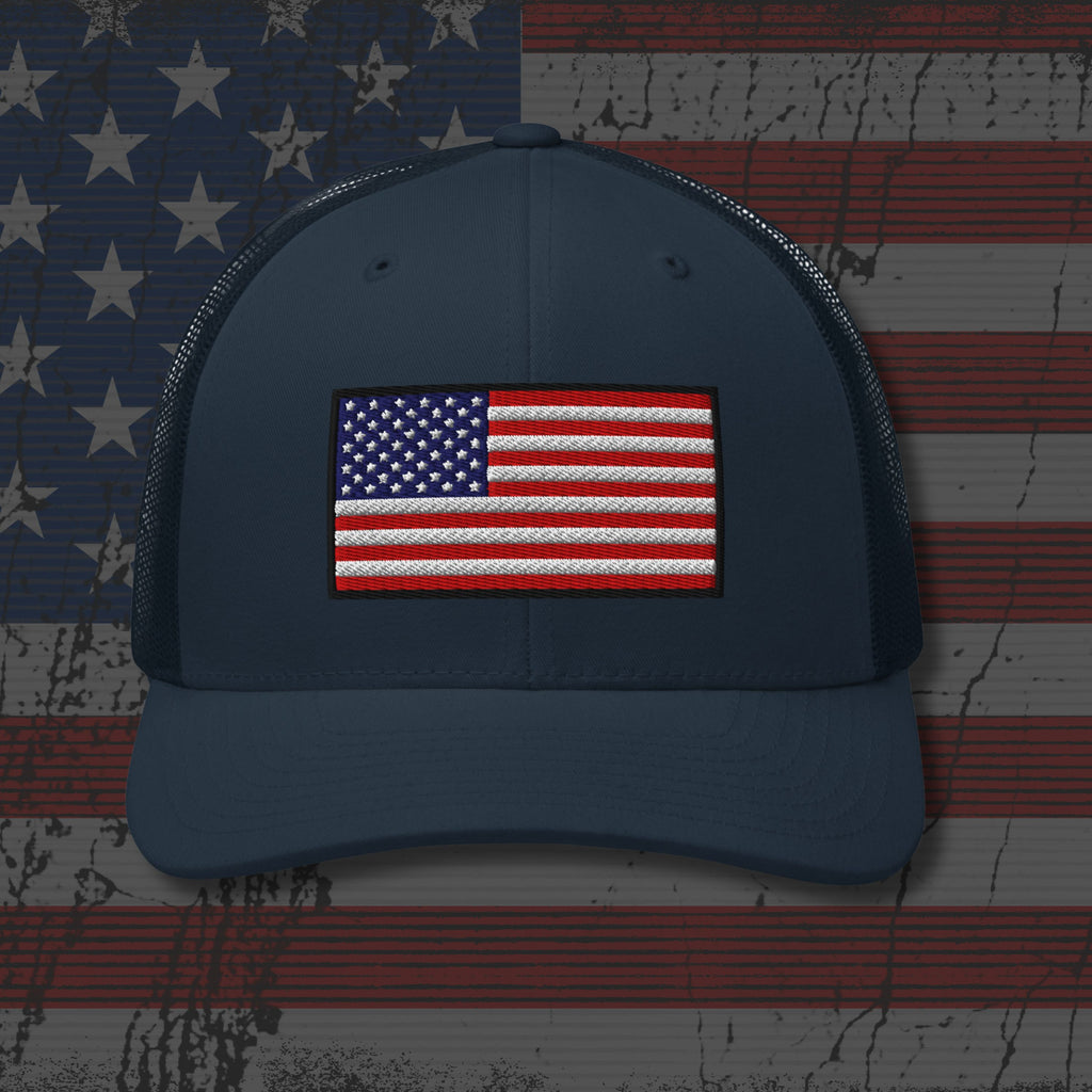 Navy blue cap with American flag patch on a distressed American flag background