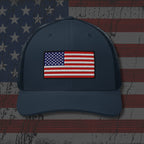 Navy blue cap with American flag patch on a distressed American flag background