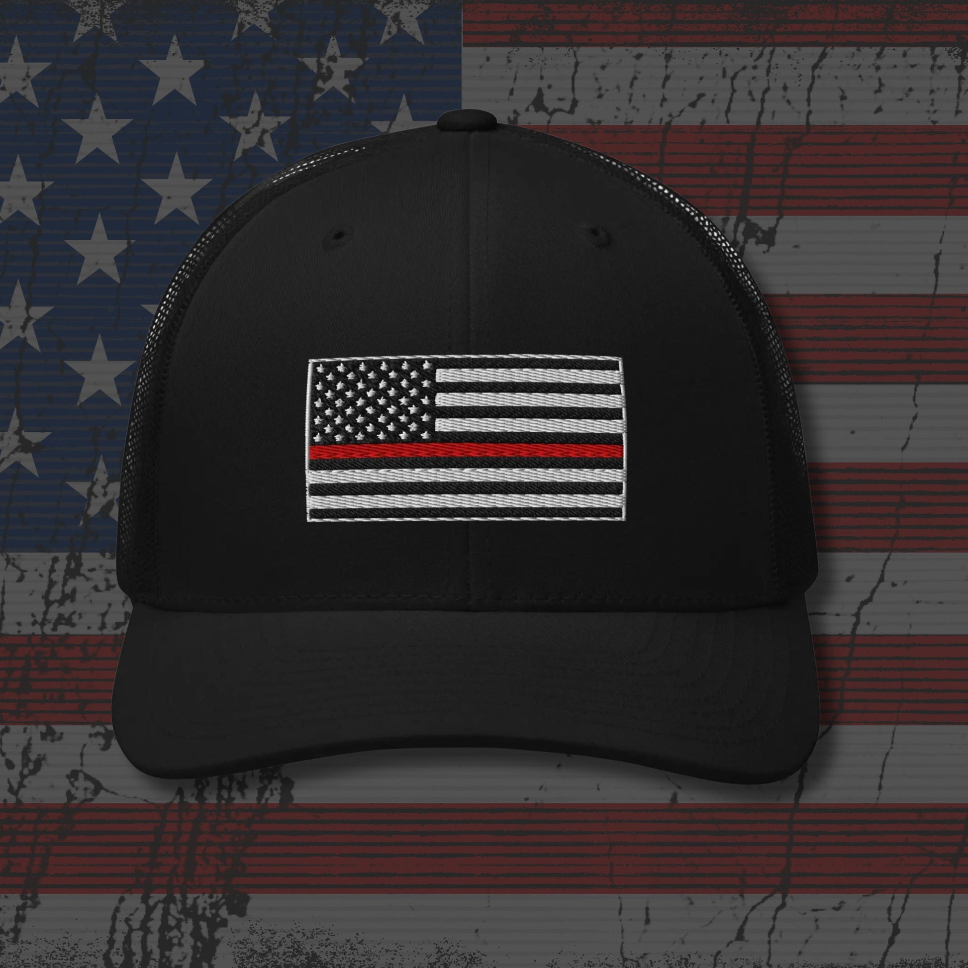 Black cap with American flag patch on a distressed American flag background