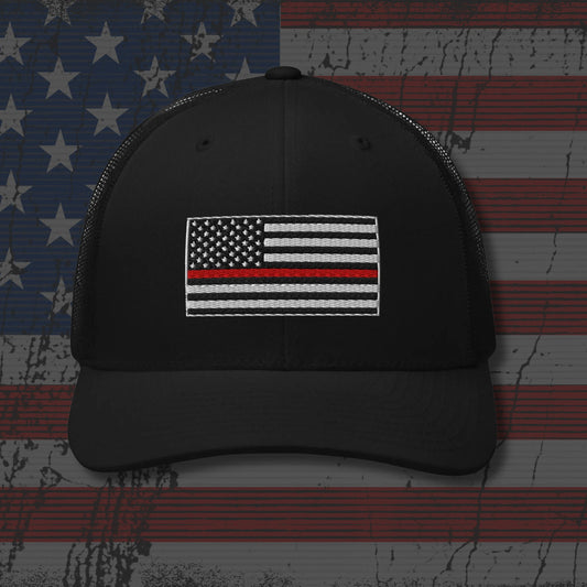 Black cap with American flag patch on a distressed American flag background