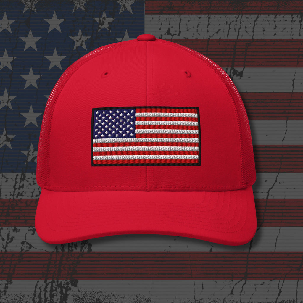 Red cap with American flag patch on a distressed American flag background