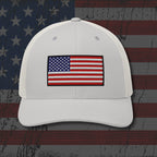 White cap with American flag patch on a distressed American flag background