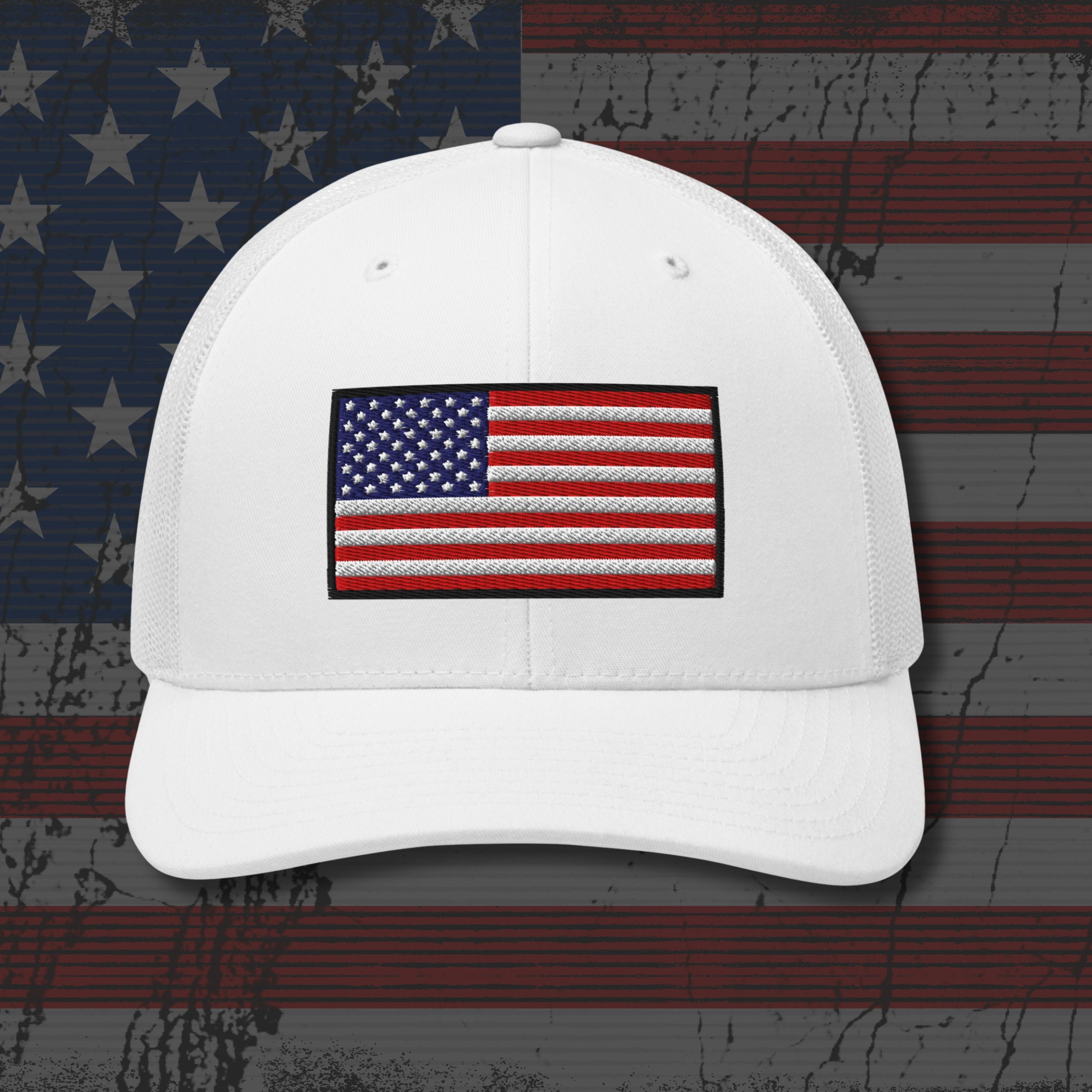 White cap with American flag patch on a distressed American flag background