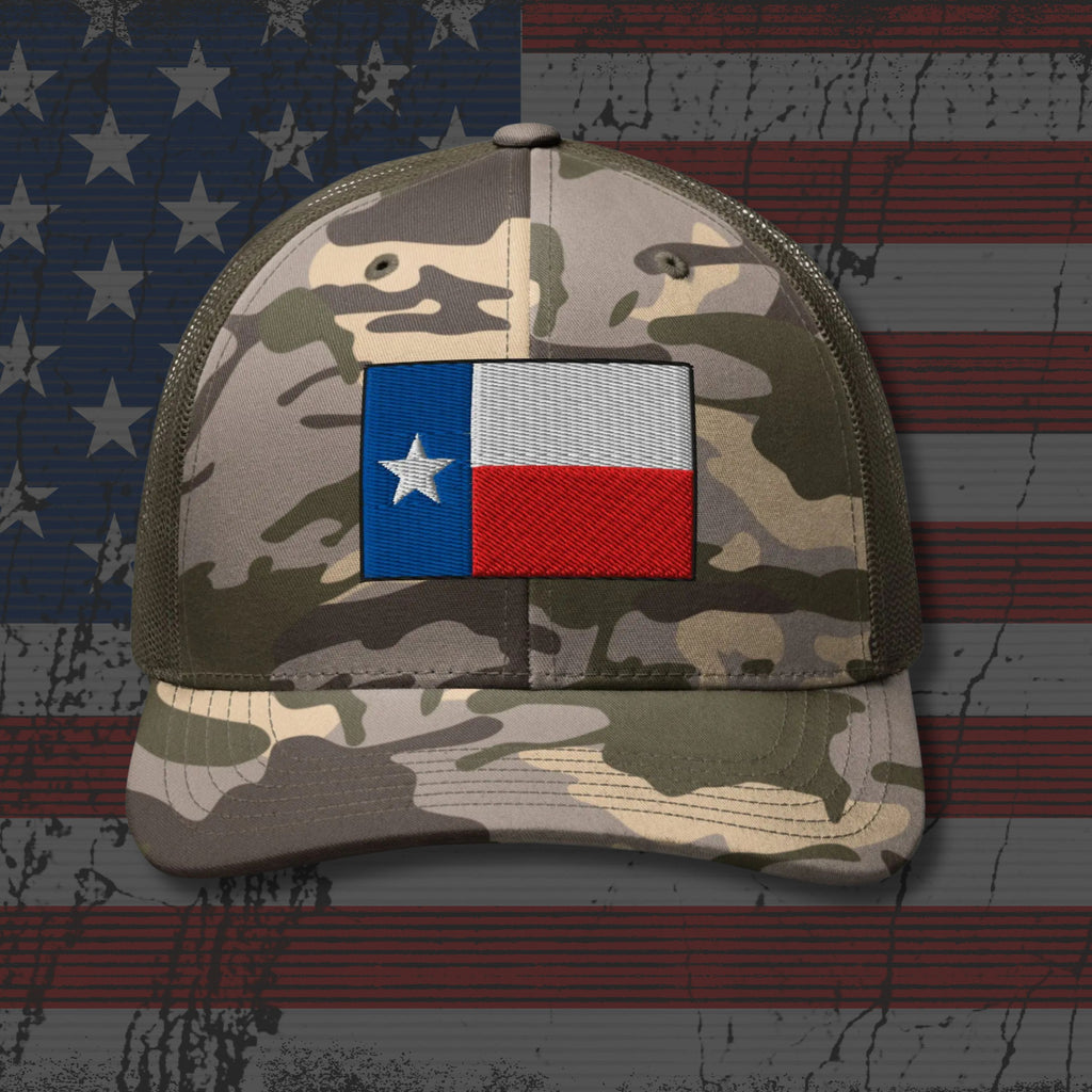 Camouflage cap with Texas flag patch on an American flag background