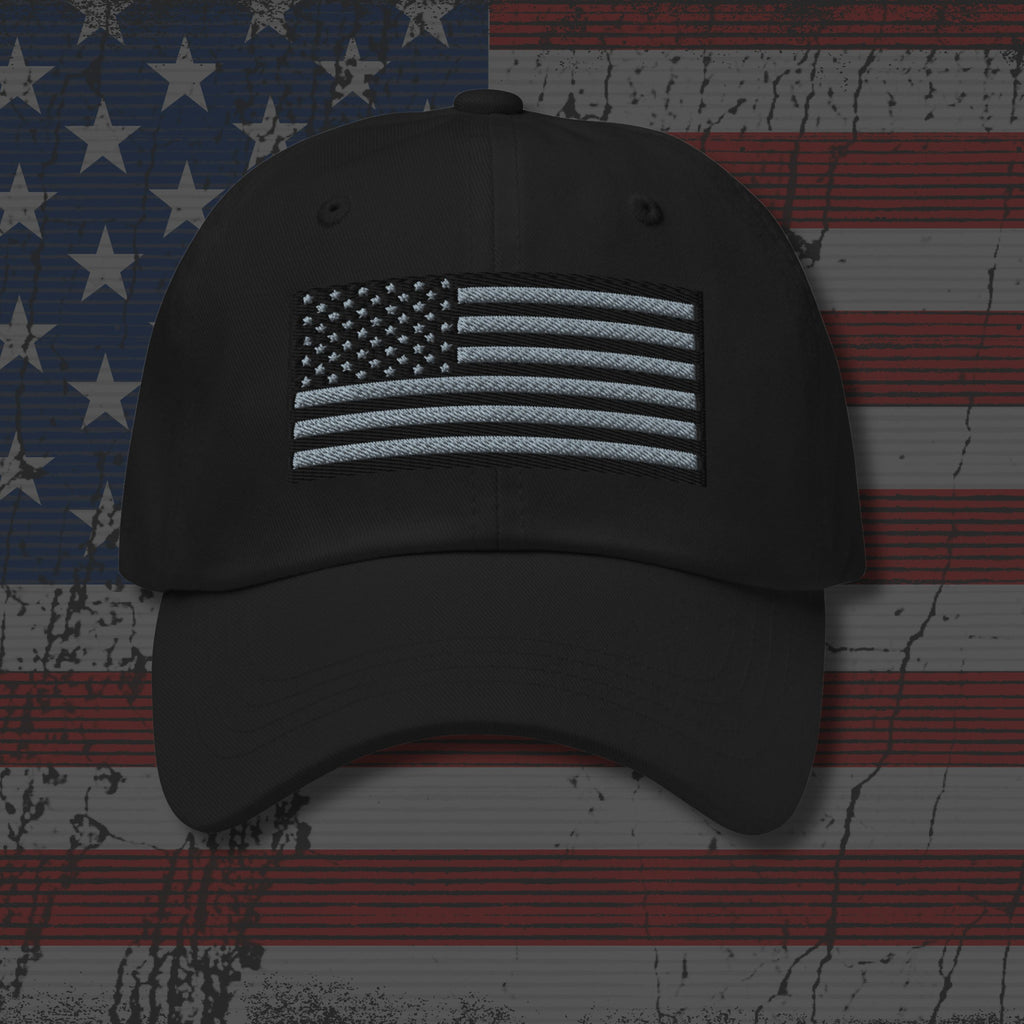 Black cap with American flag patch on a distressed American flag background