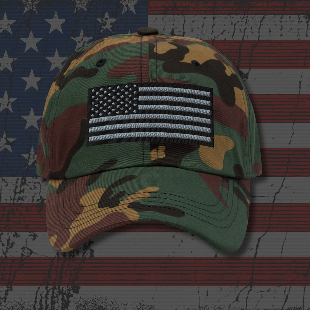 Camouflage baseball cap with American flag patch on an American flag background