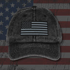 Vintage-style cap with American flag patch on an American flag background