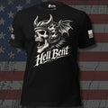 A black short-sleeve graphic T-shirt displayed against a distressed American flag background. The shirt features a large white skull wearing a horned Viking helmet with a dragon wing, above the stylized text 'Hell Bent'.