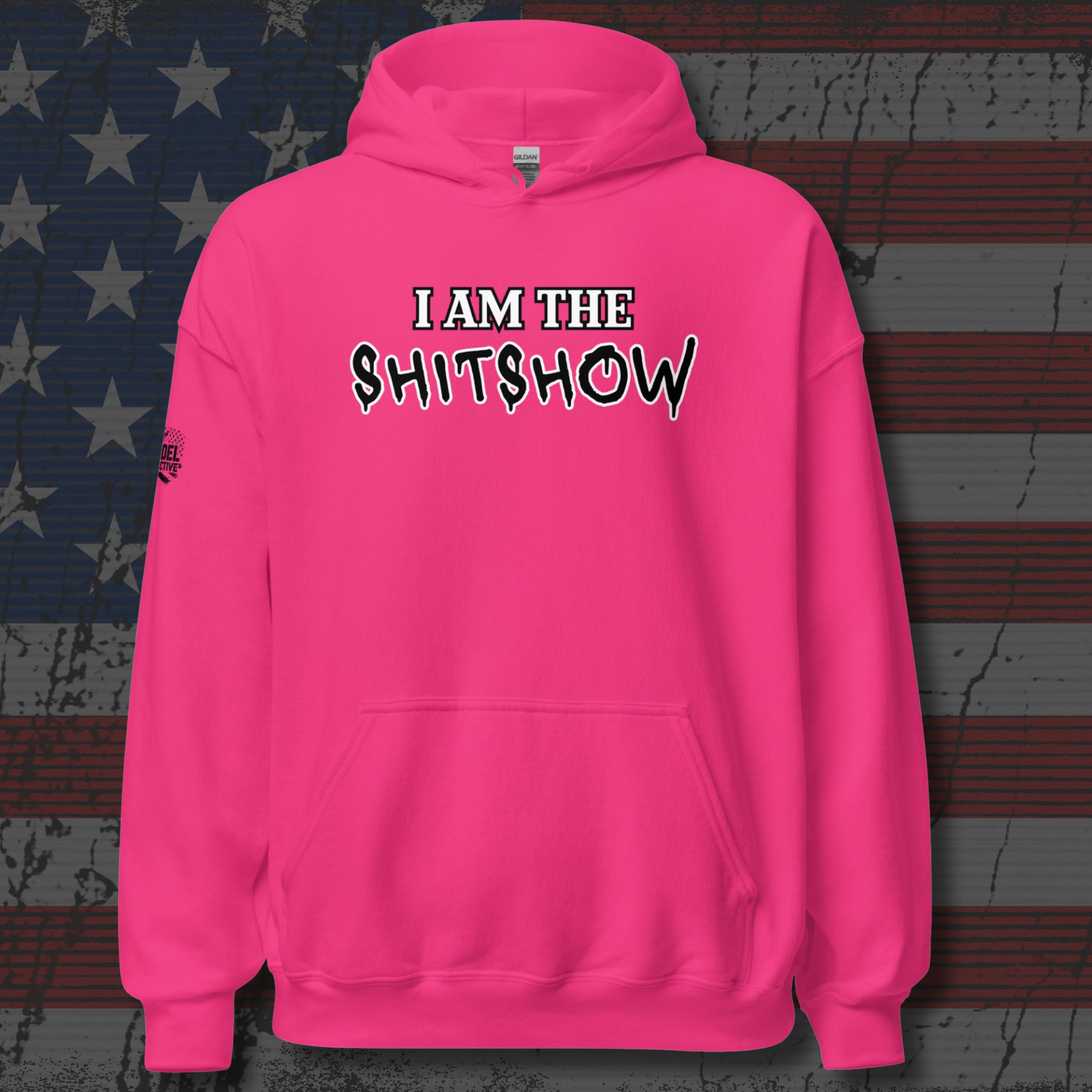 Bright pink sweatshirt with the text 'I am the shitshow' text on distressed American flag background
