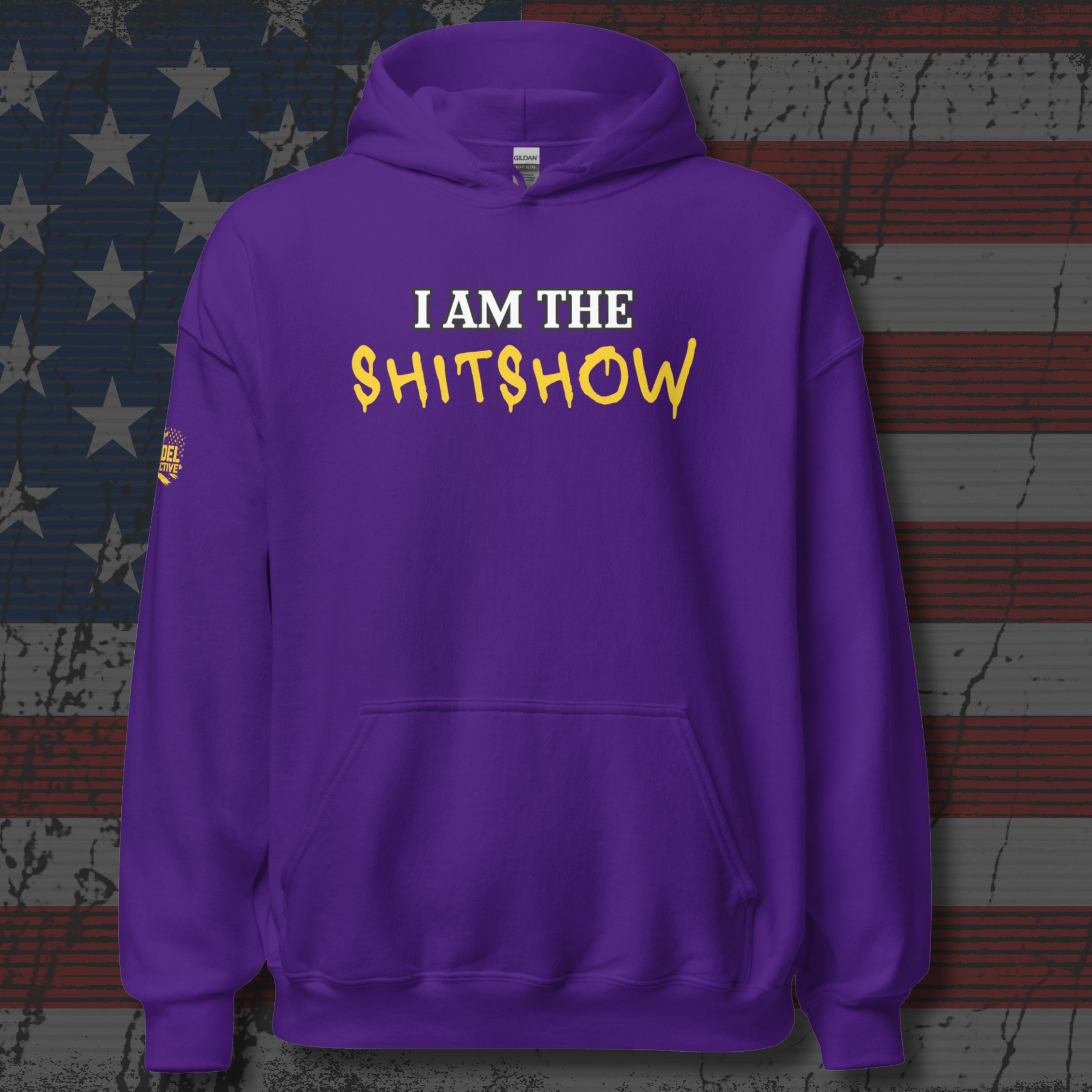 Purple hoodie with text 'I AM THE SHITSHOW' on a textured background