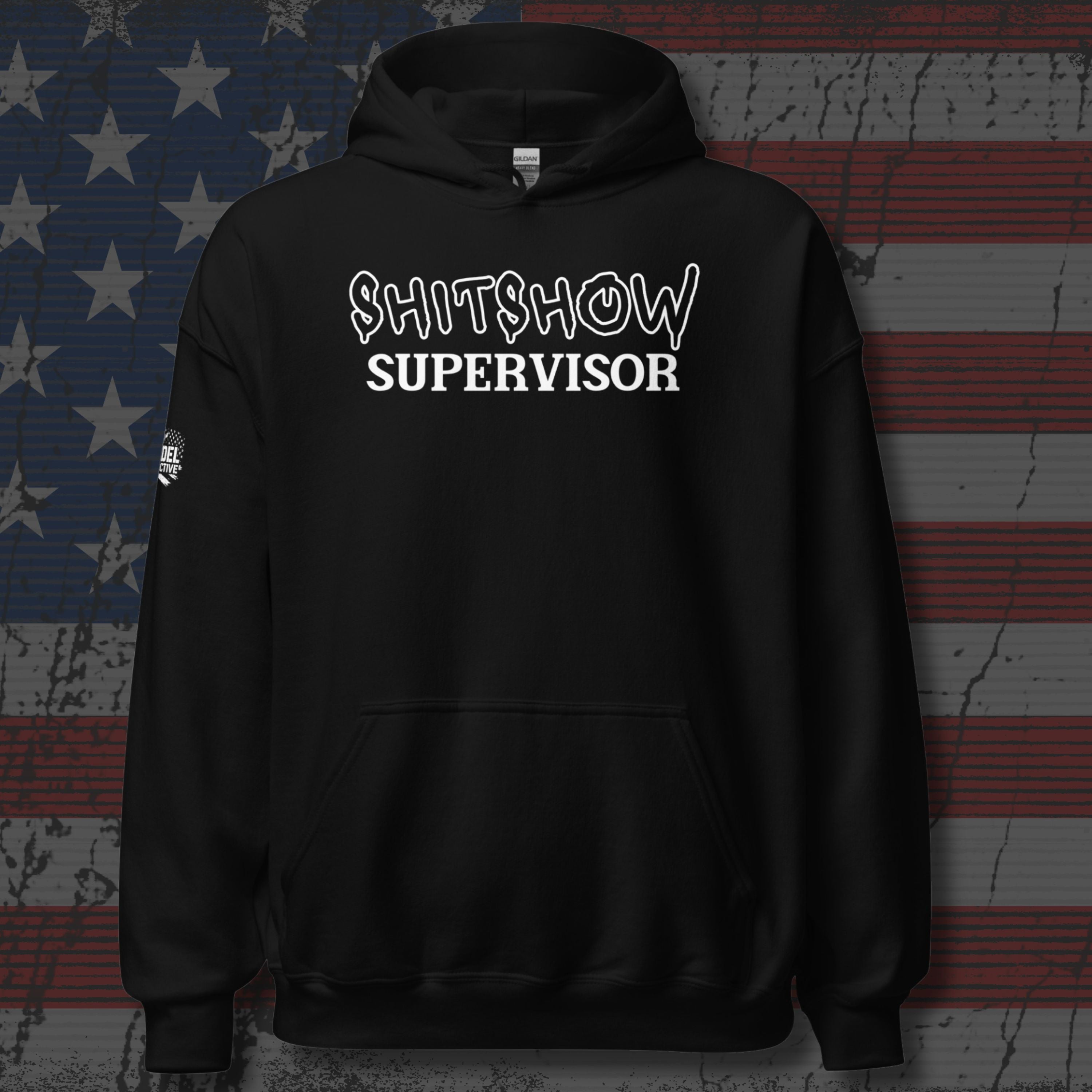 Black hoodie with 'Shitshow Supervisor' text on distressed American flag background