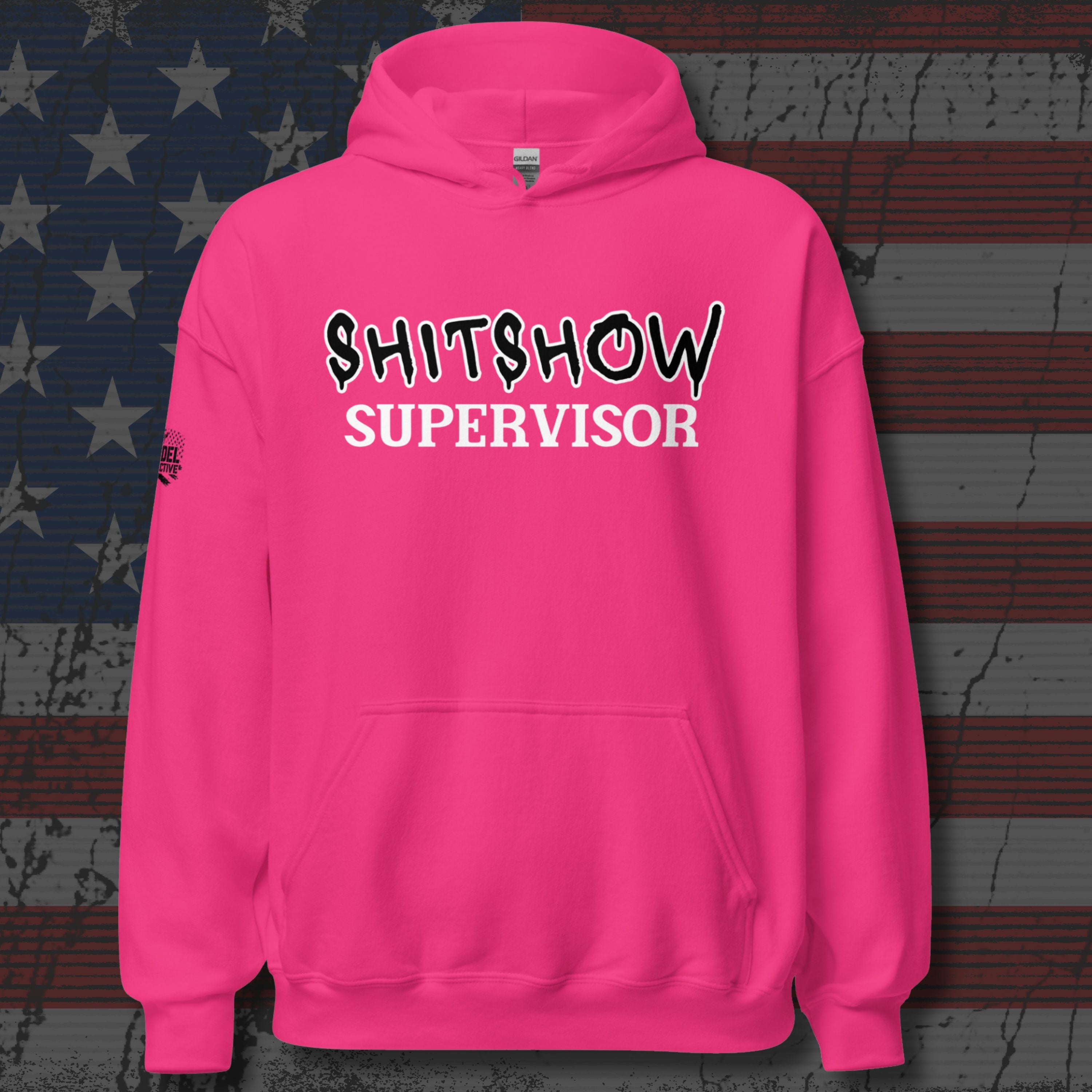 Pink hoodie with 'SHITSHOW SUPERVISOR' text on a textured background