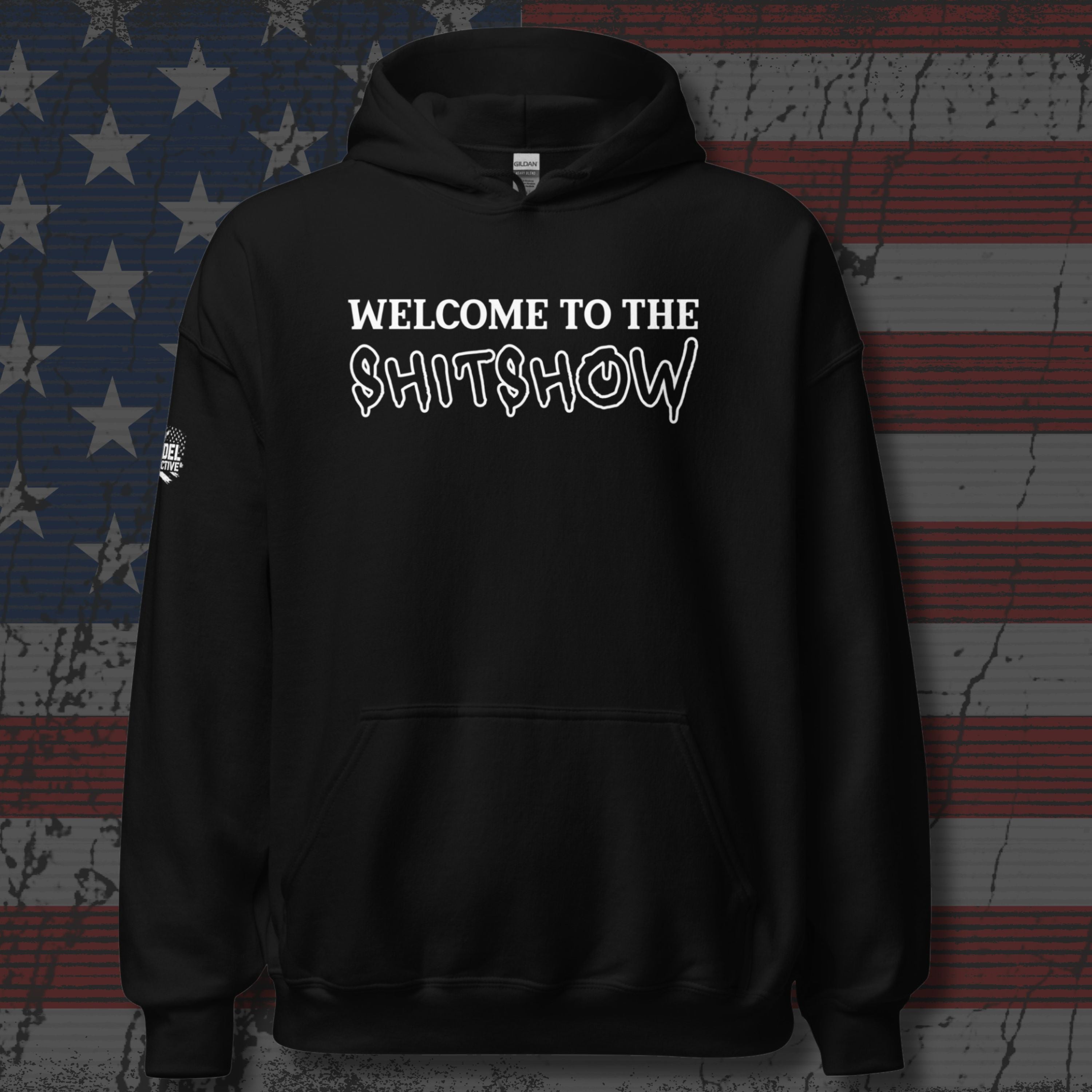 Black hoodie with 'Welcome to the Sh!tshow' text on a distressed American flag background