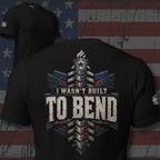 Black tee with back print featuring distressed patriotic steel framework and the text I Wasn't Built to Bend