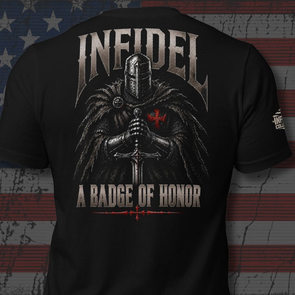 Black short-sleeve graphic T-shirt shown from the back, featuring a large medieval knight design with the text 'INFIDEL' at the top and 'A BADGE OF HONOR' at the bottom. The shirt is photographed against a distressed American flag background.