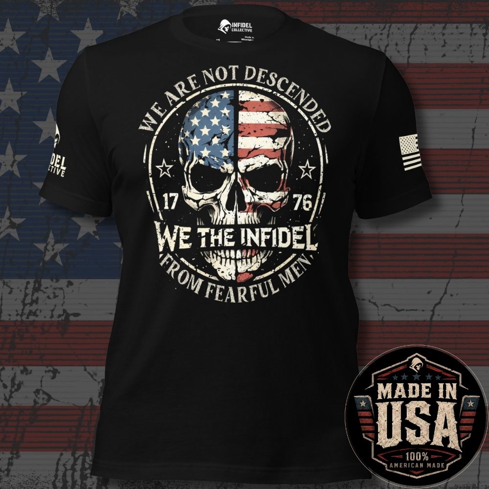 A black short-sleeve graphic T-shirt displayed against a distressed American flag background. The front graphic shows a skull split with an American flag pattern, surrounded by the text 'WE ARE NOT DESCENDED FROM FEARFUL MEN' and 'WE THE INFIDEL'. An American USA flag on the left sleeve and the brand loo on the right sleeve 'INFIDEL COLLECTIVE' - and logo confirming this product is MADE IN USA.