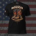 Black t-shirt with cowboy boots and American flag design against a distressed American flag background