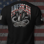 Black short-sleeve t-shirt shown from the back, featuring a large graphic print of a coiled snake with an open mouth and the words 'AMERICAN' above and 'INFIDEL' below, styled with an American flag motif. The shirt is displayed against a distressed American flag background.