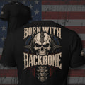 armored skull and spine with Born With Backbone text back print black tee from Infidel Collective