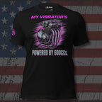 Black t-shirt with pink and white graphic design on an American flag background