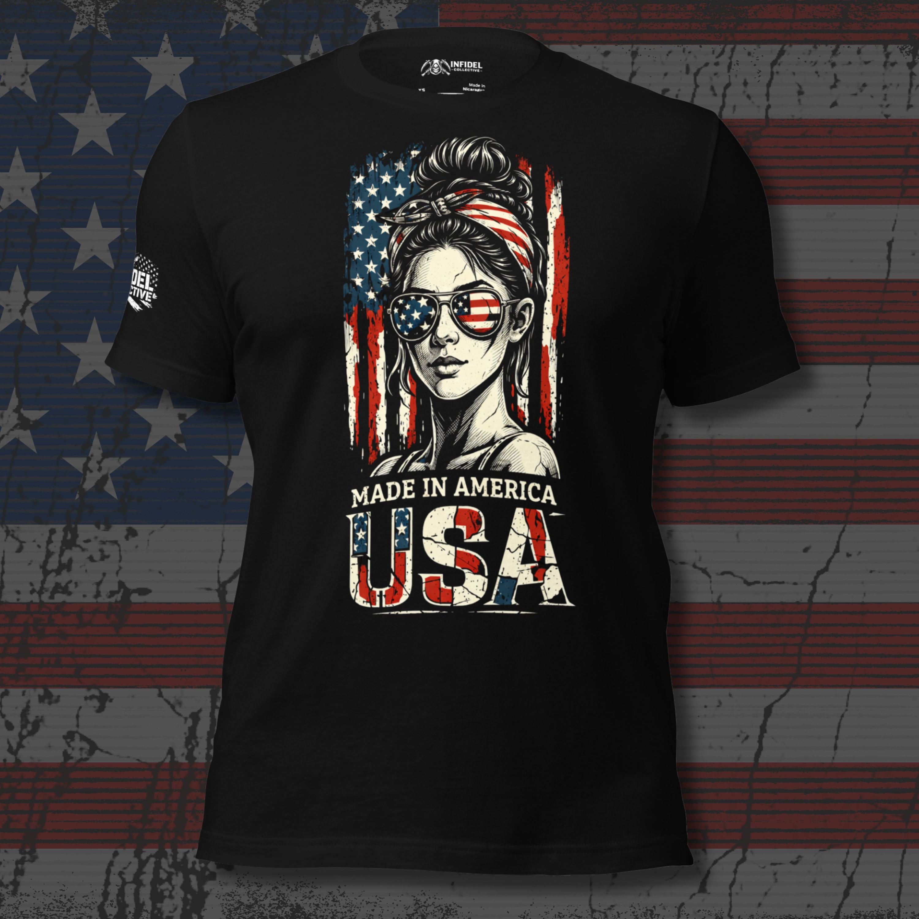 Black t-shirt with a graphic of a woman with an American flag headband and sunglasses, text 'Made in America USA' on a distressed American flag background.