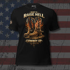 Black front print t-shirt featuring patriotic flame cowboy boots with Ready To Raise Hell Cowboy Up western graphic
