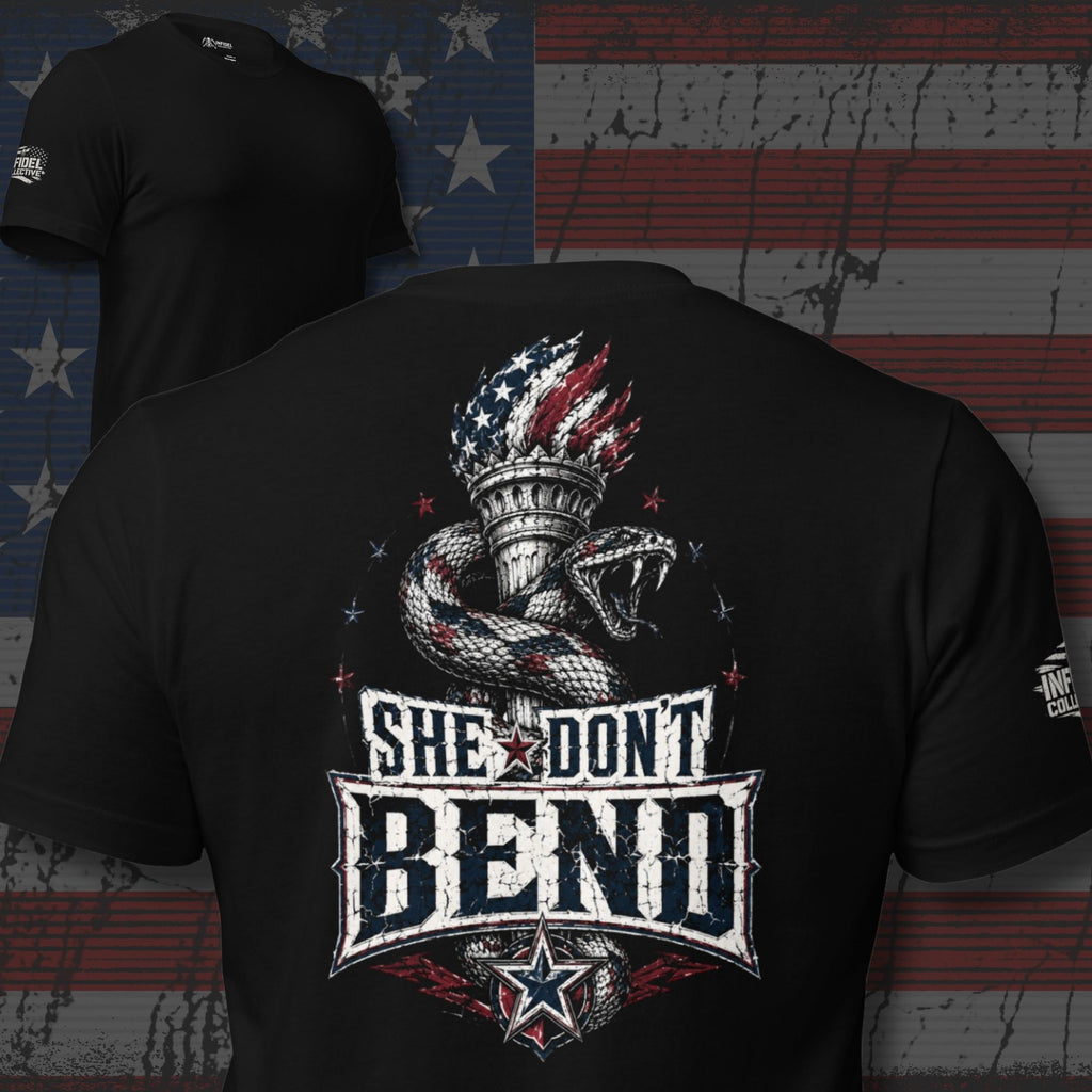 Black tee with back print featuring a rattlesnake wrapped around the Statue of Liberty torch and the text She Don't Bend in distressed patriotic lettering