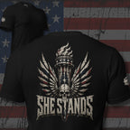 She Stands women liberty torch skull graphic black tee from Infidel Collective