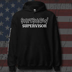Black hoodie with 'SHITSHOW SUPERVISOR' text on a distressed American flag background