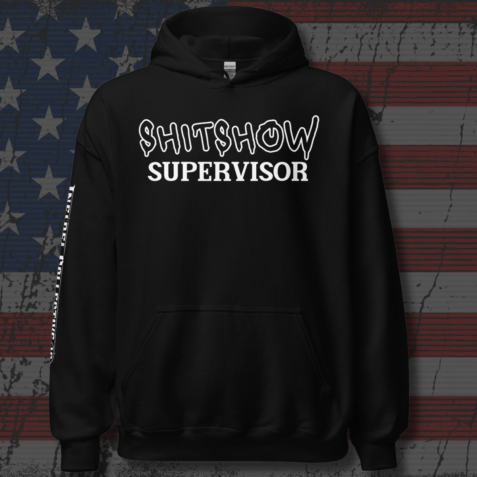 Black hoodie with 'SHITSHOW SUPERVISOR' text on a distressed American flag background