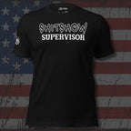 Black t-shirt with 'SHITSHOW SUPERVISOR' text on a distressed American flag background