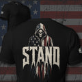 Stand hooded reaper in American flag cloak back print black tee from Infidel Collective