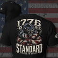 1776 Is the Standard American flag rattlesnake design back print black tee from Infidel Collective