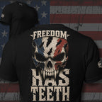 Black t-shirt with a skull design and 'Freedom Has Teeth' text on an American flag background