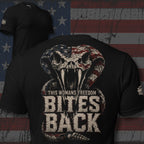 This Woman Ain't Here To Yield back print graphic on black tee featuring a hooded skull with American flag wings and a liberty torch