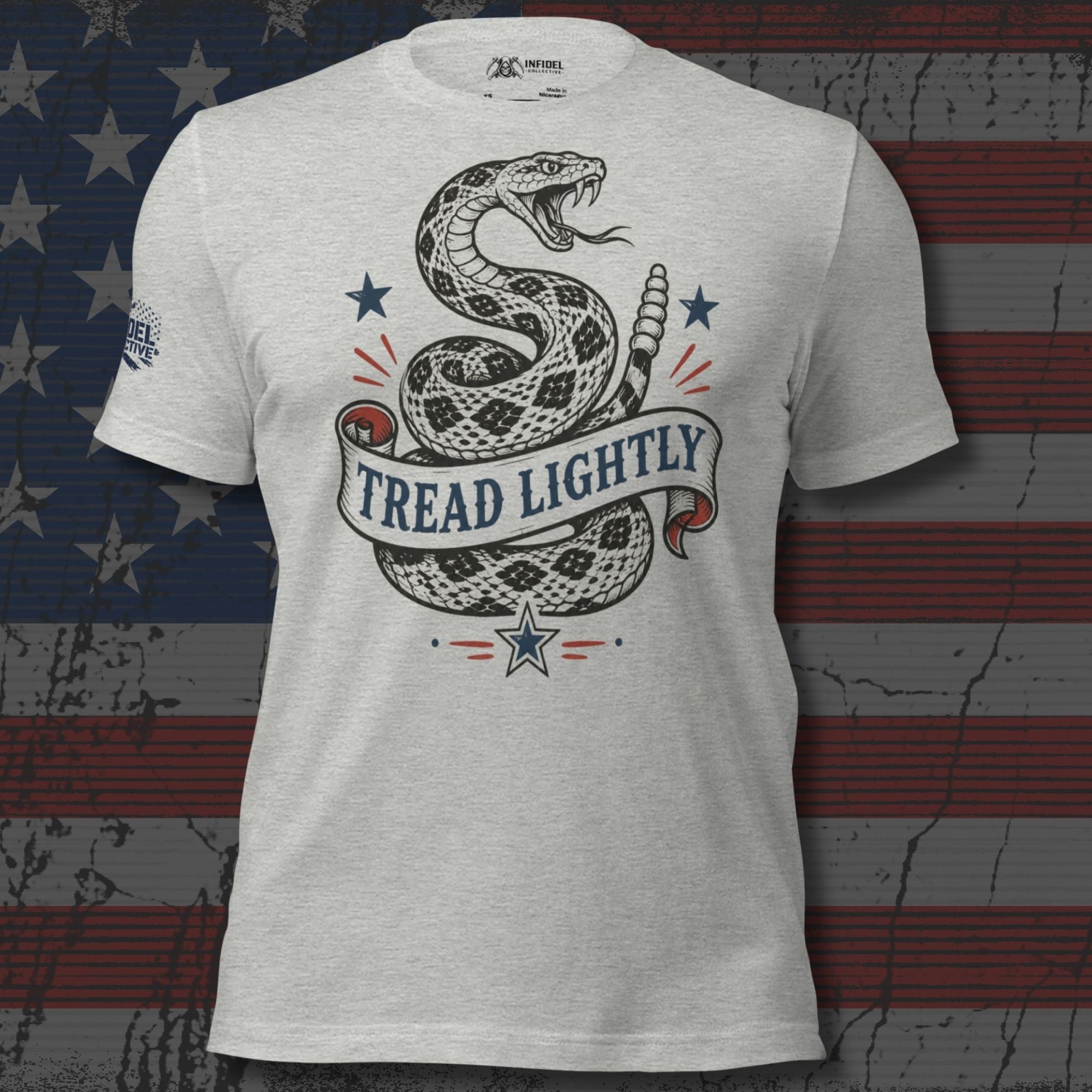 Athletic heather tee with front print of a coiled rattlesnake, patriotic stars, and a banner reading Tread Lightly