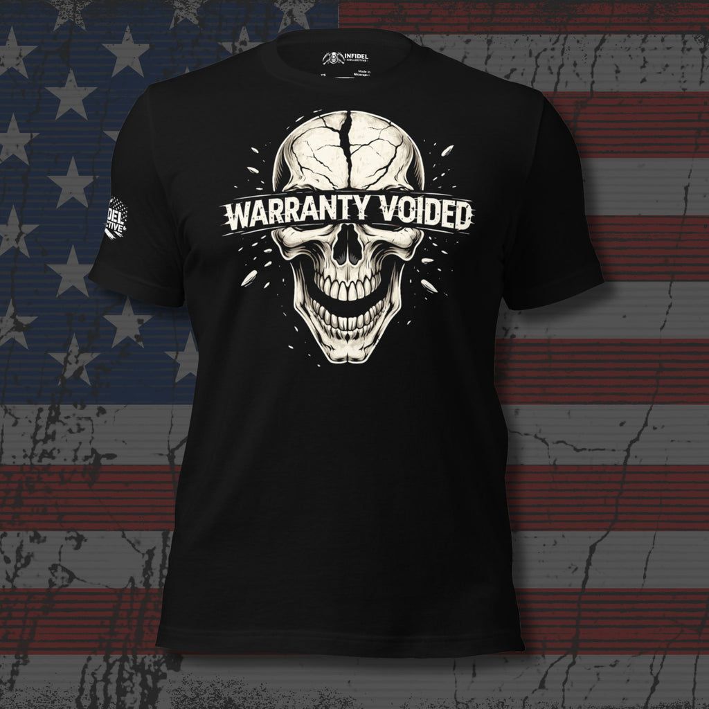 Black tee with Warranty Voided front print featuring a cracked skull graphic and distressed lettering across the eyes