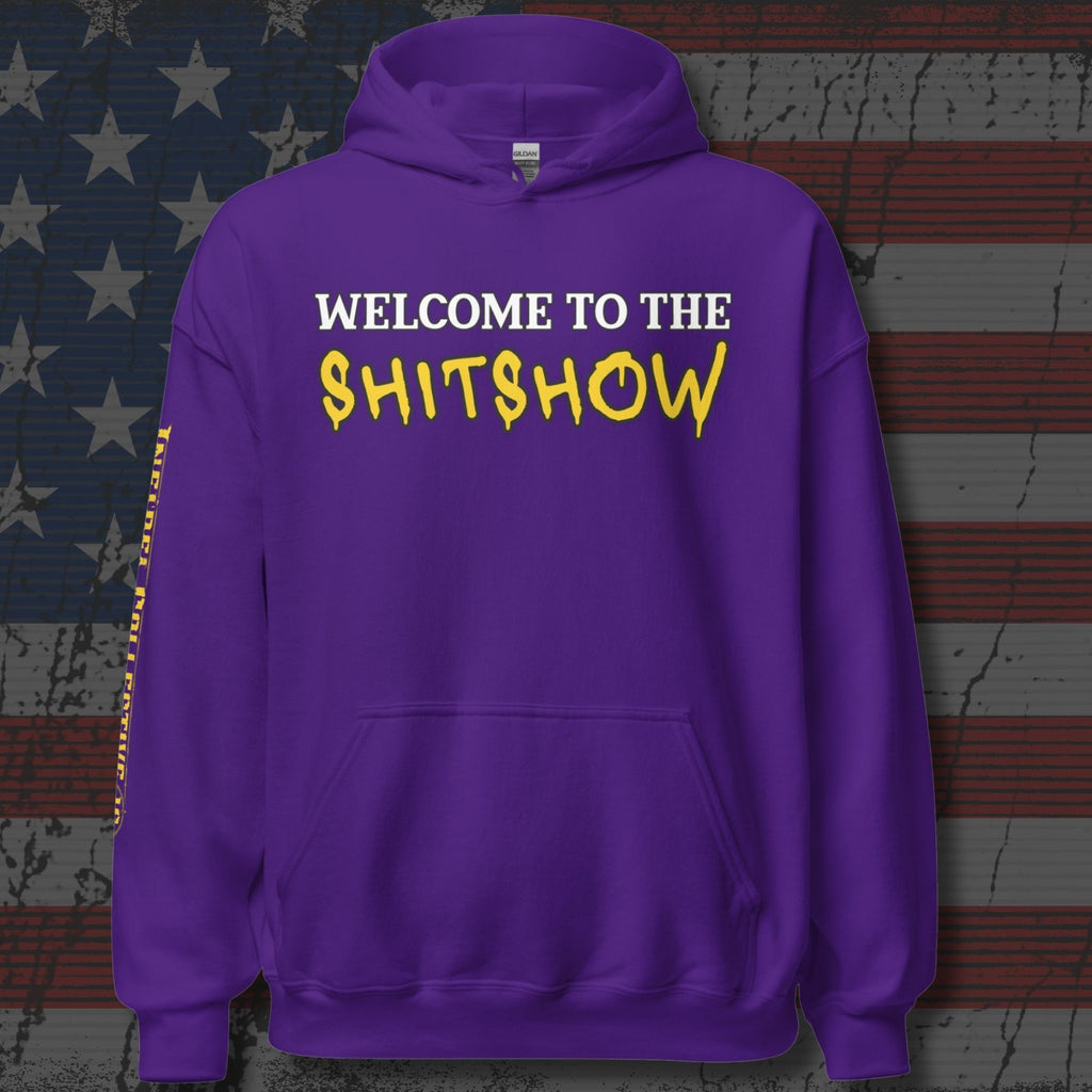 Purple hoodie with text 'WELCOME TO THE SHITSHOW' on a distressed American flag background