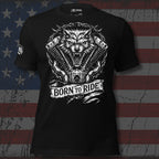 Black t-shirt with a wolf and engine design and 'Born to Ride' text on an American flag background.