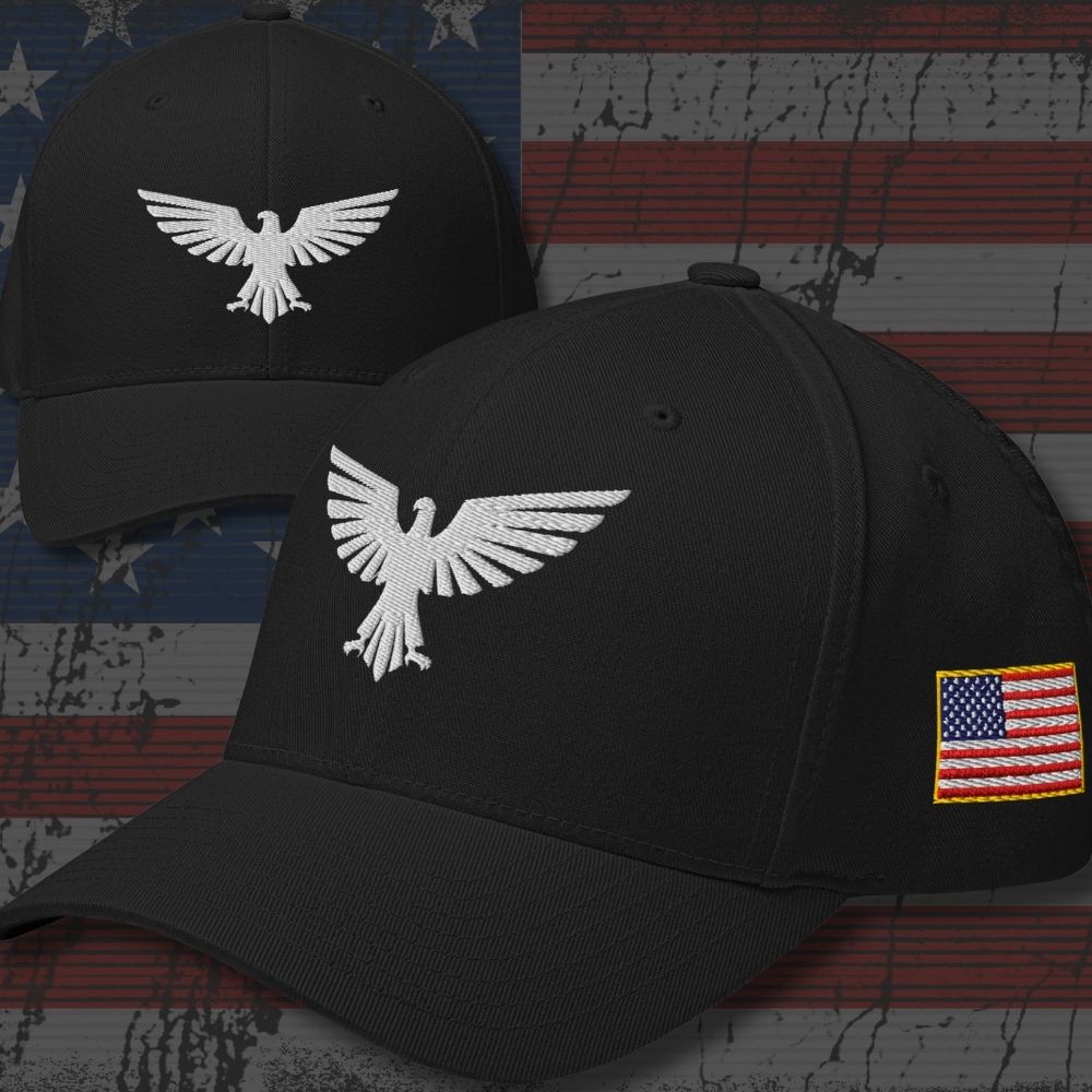 Two black baseball caps shown against a distressed American flag background. The front cap features a white embroidered eagle logo on the front panel and a small American flag patch on the side.