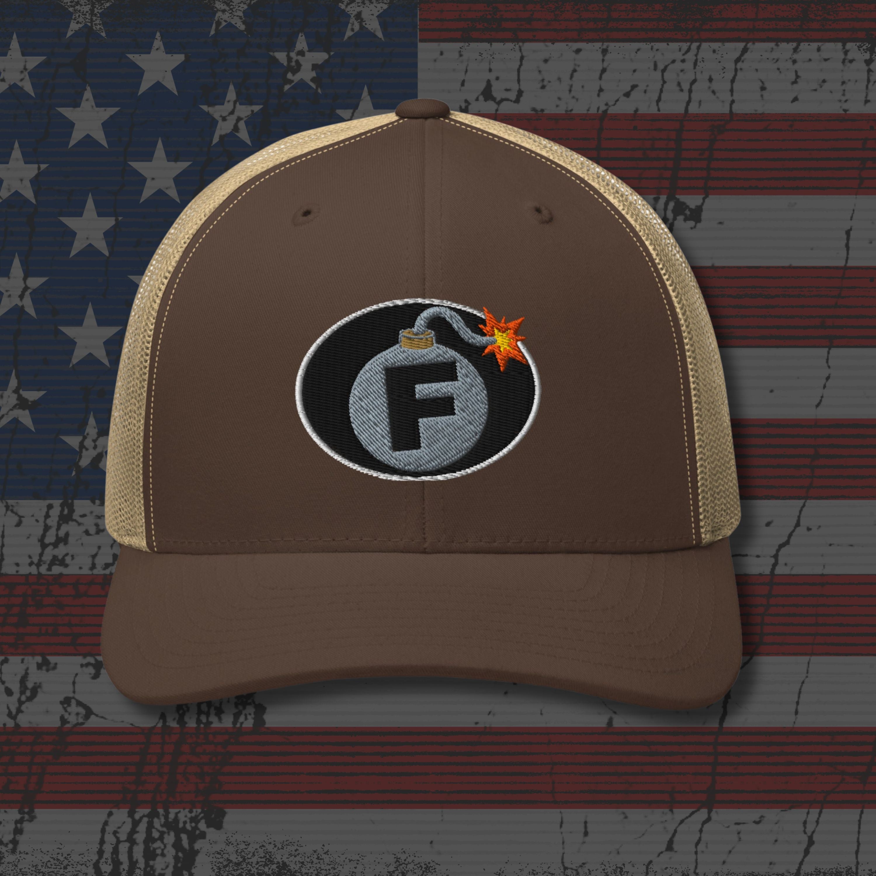 Brown cap with bomb graphic and letter 'F' on an American flag background