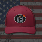 Red cap with a bomb graphic featuring the letter 'F' on an American flag background
