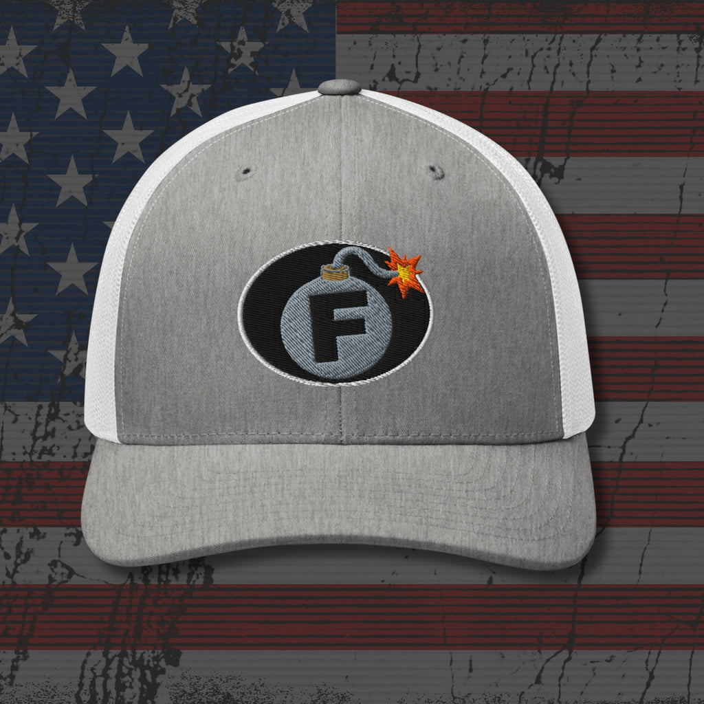 Gray and white cap with a bomb-themed logo on an American flag background